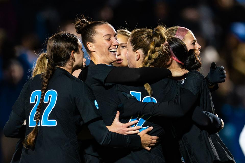 Brigham Young University teammates celebrate forward Brecken Mozingo (13) after making a penalty kick during the Sweet 16 round of the NCAA College Women’s Soccer Tournament against Michigan State at South Field in Provo on Saturday, Nov. 18, 2023.