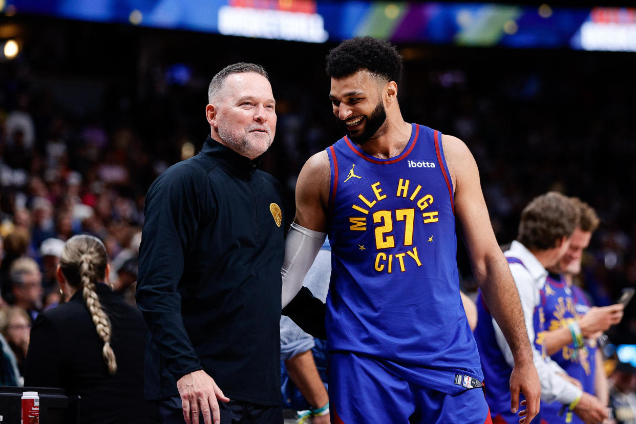 Denver Nuggets head coach Michael Malone and guard Jamal Murray laugh during the fourth quarter against the Los Angeles Lakers at Ball Arena in Denver on Oct. 24, 2023. (Isaiah J. Downing/USA TODAY Sports)