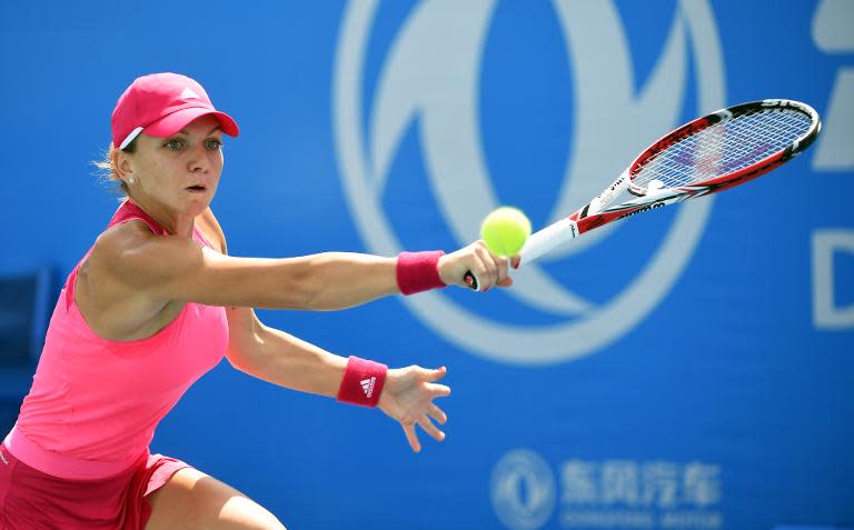 World number two Romania&#39;s Simona Halep in shock exit in her first match in the inaugral WTA Wuhan Open in China&#39;s Hubei province on September 23, 2014