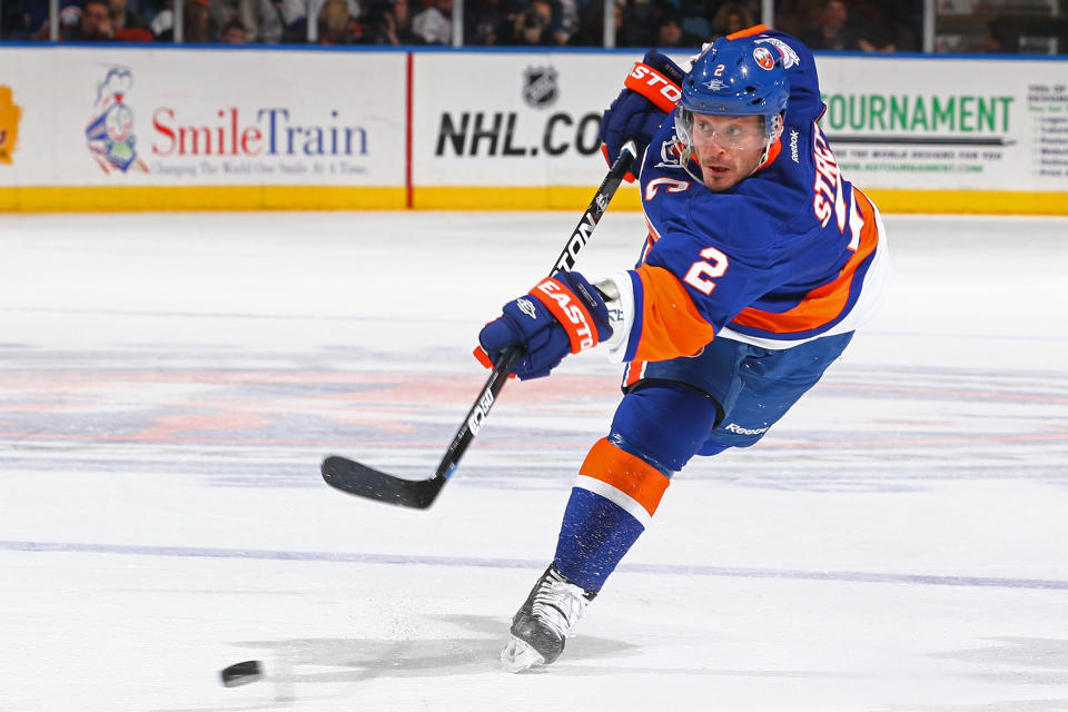 UNIONDALE, NY - FEBRUARY 12: Mark Streit #2 of the New York Islanders shoots the puck against the Florida Panthers during their game on February 12, 2012 at the Nassau Coliseum in Uniondale, New York. (Photo by Al Bello/Getty Images)