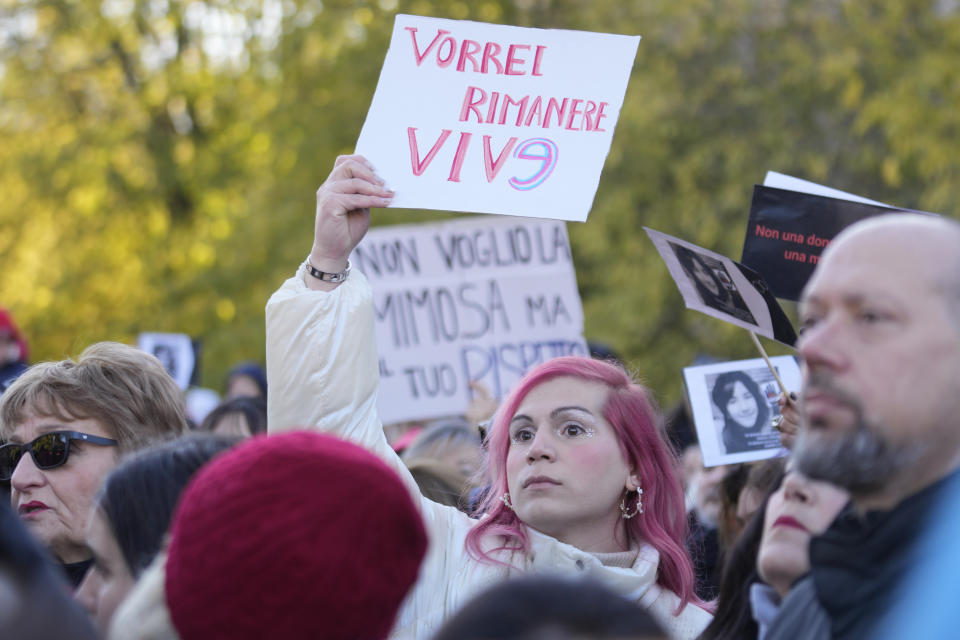 A woman shows a banner reading "I want to stay alive" during a gathering on the occasion of International Day for the Elimination of Violence against Women, in Milan, Italy, Saturday, Nov.25, 2023. Thousands of people are expected to take the streets in Rome and other major Italian cities as part of what organizers call a "revolution" under way in Italians' approach to violence against women, a few days after the horrifying killing of a college student allegedly by her resentful ex-boyfriend sparked an outcry over the country's "patriarchal" culture. (AP Photo/Luca Bruno)