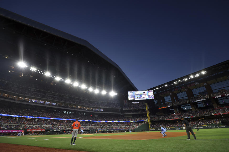 The Houston Astros play the Texas Rangers with the roof open in the eighth inning of a baseball game Sunday, April 7, 2024, in Arlington, Texas. (AP Photo/Richard W. Rodriguez)