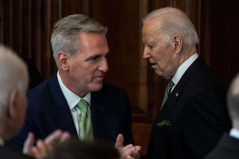 WASHINGTON, DC - MARCH 17: President Joe Biden, walks past Speaker of the House Kevin McCarthy (R-CA) after delivering remarks at the annual Friends of Ireland Caucus St. Patrick's Day Luncheon in the Rayburn Room of the U.S. Capitol on Friday, March 17, 2023 in Washington, DC. The Friends of Ireland caucus was founded in 1981 by the late Irish-American politicians Irish-American politicians Sen. Ted Kennedy (D-MA), Sen. Daniel Moynihan (D-NY) and former Speaker of the House Tip O'Neill (D-MA). (Kent Nishimura / Los Angeles Times)