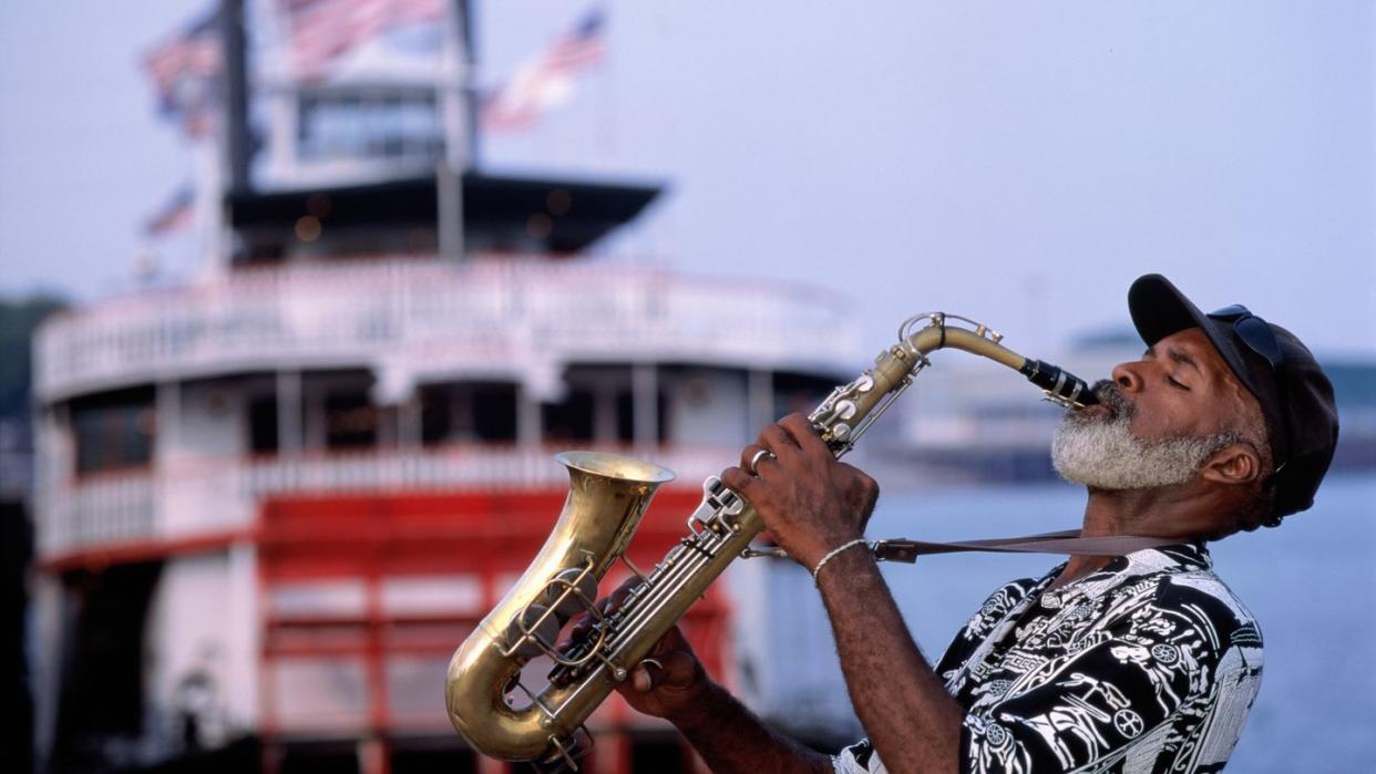 usa, louisiana, new orleans, saxophonist and paddle steamer