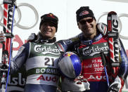 FILE - Bode Miller of the United States, right, winner of the Men's Downhil, poses next to second placed fellow countryman Daron Rahlves,l at the World Alpine Ski Championships, in Bormio, Italy, Saturday, Feb. 5, 2005. Mikaela Shiffrin's record 83rd World Cup victory Tuesday, Jan. 24, 2023 is only the latest exploit by an American team that has been producing success after success on the circuit since Daron Rahlves and Bode Miller started it all off more than 20 years ago. (AP Photo/Luca Bruno, File)