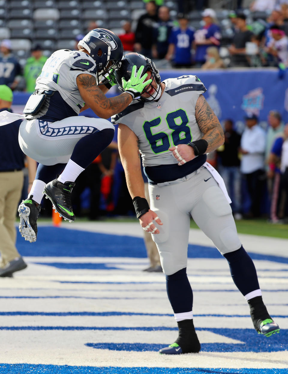 <p>Thomas Rawls #34 of the Seattle Seahawks reacts with teammate Justin Britt #68 during warm-ups before taking on the New York Giants at MetLife Stadium on October 22, 2017 in East Rutherford, New Jersey. (Photo by Abbie Parr/Getty Images) </p>