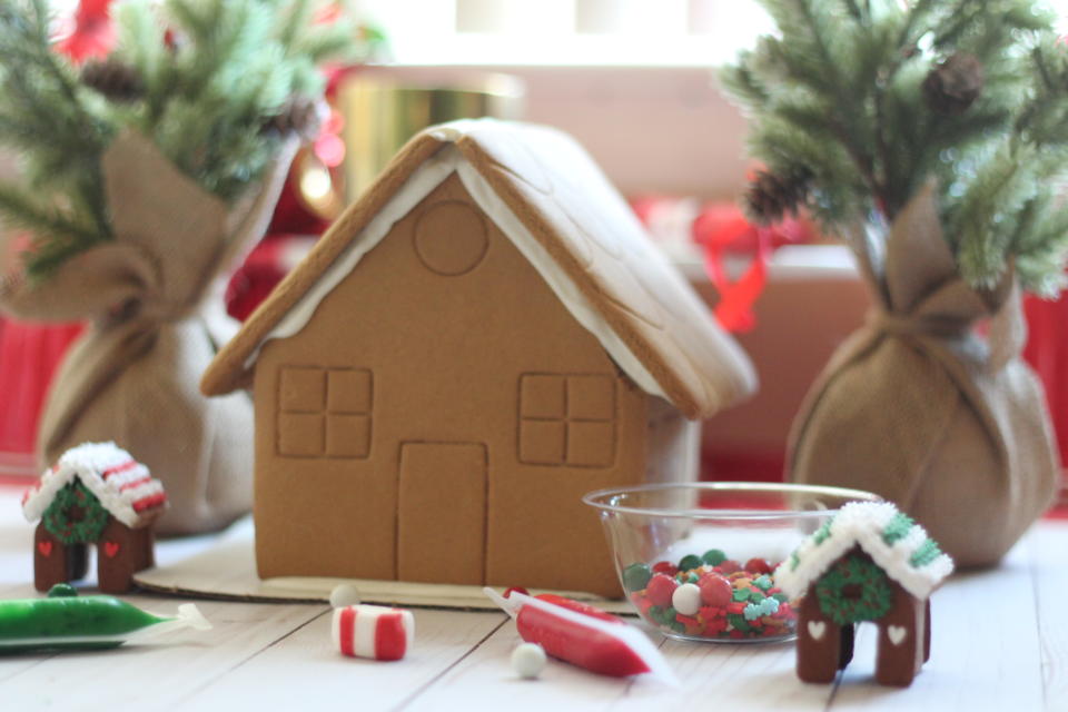 Making festive ginger bread houses helps to bring out the holiday spirit!