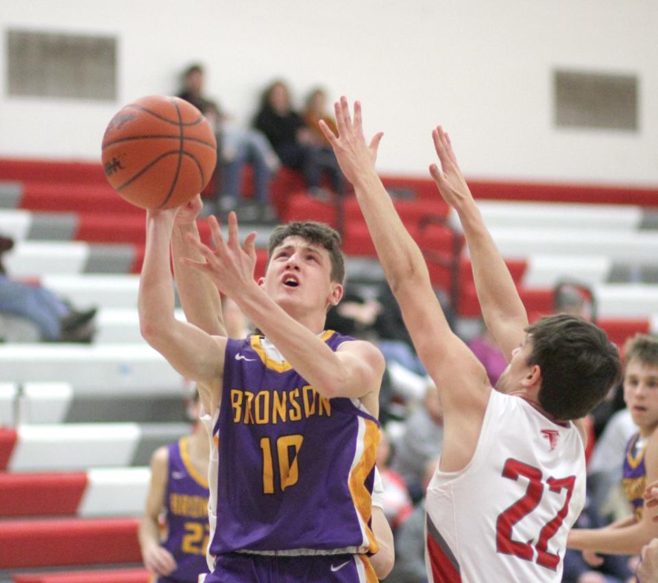 Dom Kiomento puts up a shot for Bronson against Constantine in prep hoops action on Wednesday.