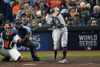 Atlanta Braves' Dansby Swanson hits a two-run home run during the fifth inning in Game 6 of baseball's World Series between the Houston Astros and the Atlanta Braves Tuesday, Nov. 2, 2021, in Houston. (AP Photo/Sue Ogrocki)