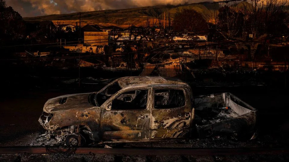 The remains of a vehicle in a burned neighborhood after wildfires in Lahaina in Maui, Hawaii, on August 18. - Bryan Anselm/New Jersey State Council for the Arts Fellowship/Redux