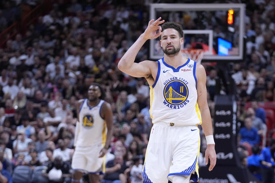 Golden State Warriors guard Klay Thompson (11) celebrates a three-point shot during the second half of an NBA basketball game against the Miami Heat, Tuesday, March 26, 2024, in Miami. Thompson scored 28 points as the Warriors beat the Heat 113-92. (AP Photo/Wilfredo Lee)