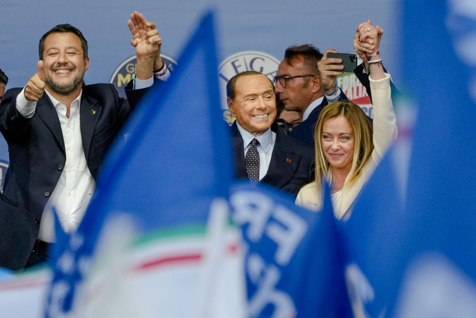 FILE-- From left, The League's Matteo Salvini, Forza Italia's Silvio Berlusconi, and Brothers of Italy's Giorgia Meloni attend the electoral campaign final rally of the center-right coalition in central Rome, Thursday, Sept. 22, 2022 . (AP Photo/Alessandra Tarantino)