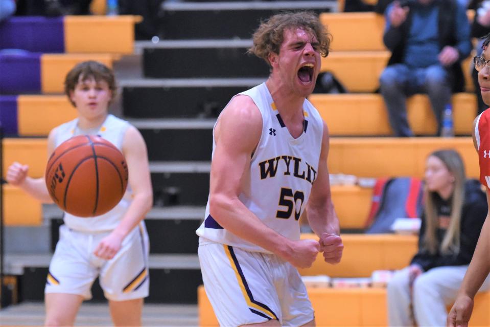 Wylie's Avery Brekke (50) lets out a yell after being fouled and making the basket during Friday's game against Lubbock Coronado at Bulldog Gym. Brekke scored a game-high 18 points in the 50-43 victory.