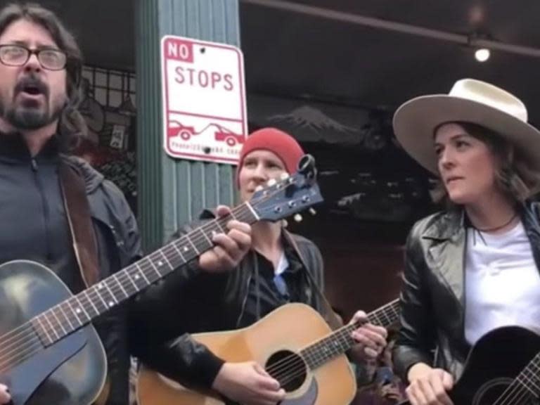 Dave Grohl and Brandi Carlile cover 'Let it Be' as Seattle buskers