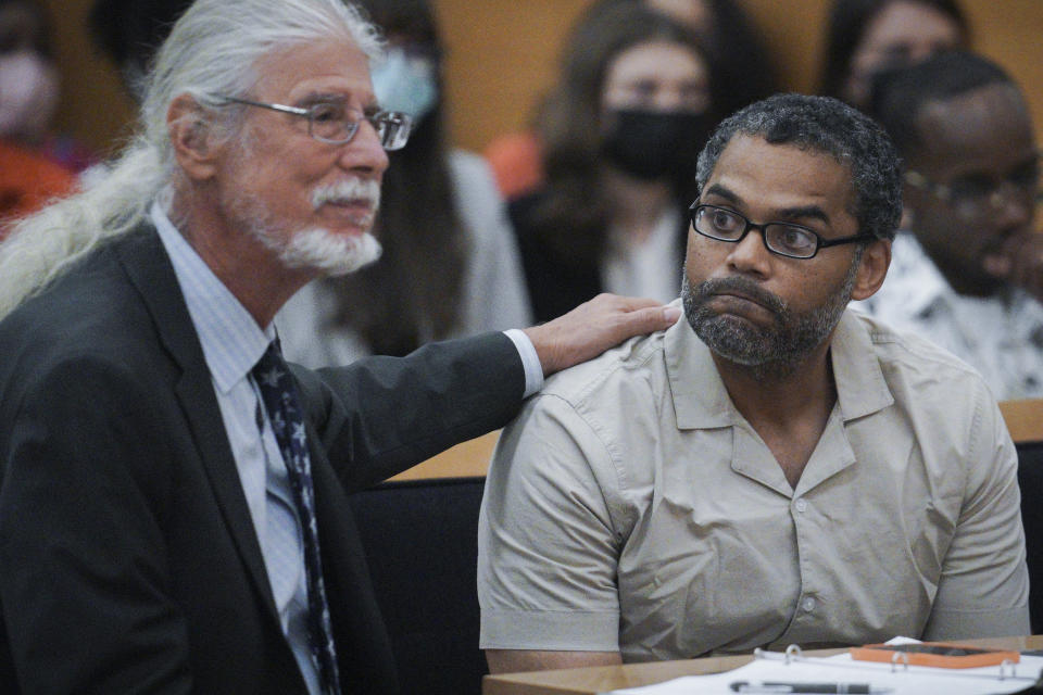 Attorney Ron Kuby, left, comforts his client Thomas Malik as he waits for the start of his exoneration hearing at Brooklyn Supreme Court, Friday July 15, 2022, in New York. (AP Photo/Bebeto Matthews)