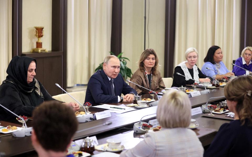 Vladimir Putin attends a meeting with mothers of Russian servicemen participating in Russia-Ukraine conflict - SPUTNIK/REUTERS