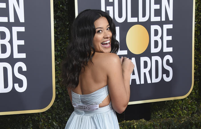 FILE - Gina Rodriguez poses on the red carpet with a ribbon that reads "Time's Up," as she arrives at the 76th annual Golden Globe Awards at the Beverly Hilton Hotel on Jan. 6, 2019, in Beverly Hills, Calif. Five years after making its public debut, the #MeToo-era's Time's Up organization is ceasing operations and shifting funds to its legal defense fund, according to the group’s board chair in an interview with The Associated Press, Friday, Jan. 20, 2023. (Photo by Jordan Strauss/Invision/AP, File)