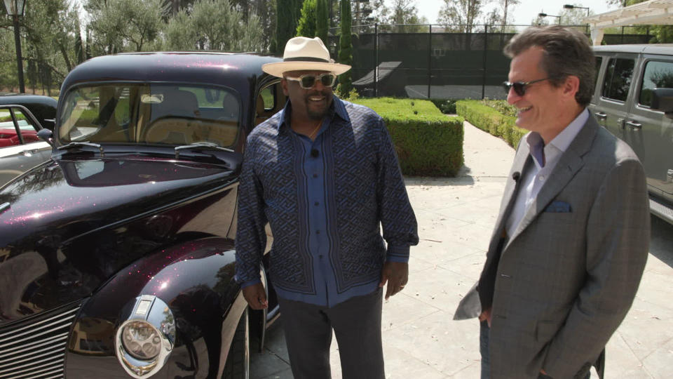 Cedric the Entertainer is, among many other things, an acquirer of vintage cars, as he shows Turner Classic Movies host Ben Mankiewicz.  / Credit: CBS News