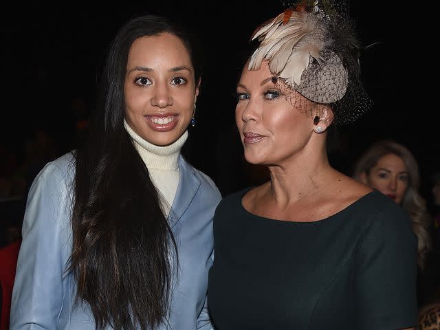 <p>Dimitrios Kambouris/Getty</p> Melanie Hervey and Vanessa Williams pose front row during the Pamela Roland New York Fashion Show