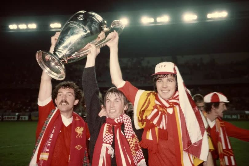 Alan Hansen celebrates with Graeme Souness and Kenny Dalglish