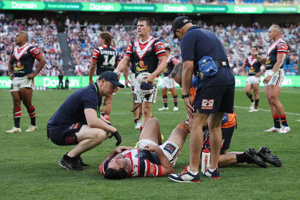 SYDNEY, AUSTRALIA - SEPTEMBER 01: Brandon Smith of the Roosters reacts to an injury during the round 26 NRL match between Sydney Roosters and Canberra Raiders at Allianz Stadium, on September 01, 2024, in Sydney, Australia. (Photo by Cameron Spencer/Getty Images)