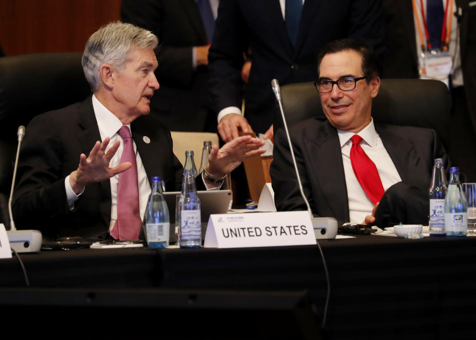 Federal Reserve Chairman Jerome Powell (L) talks with US Treasury Secretary Steven Mnuchin during the G20 finance ministers and central bank governors meeting in Fukuoka on June 8, 2019. (Photo by KIM KYUNG-HOON / POOL / AFP)        (Photo credit should read KIM KYUNG-HOON/AFP via Getty Images)