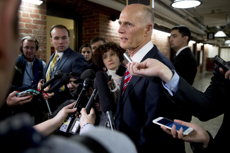 Sen. Rick Scott, R-Fla., speaks to reporters outside his office on Capitol Hill in Washington, Wednesday, Jan. 23, 2019. Scott took questions on Venezuela and the government shutdown. (AP Photo/Andrew Harnik)