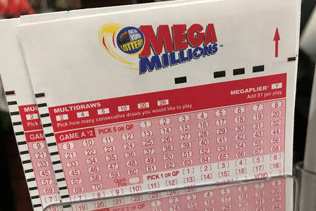 FILE PHOTO: A Mega Millions ticket is pictured in a store in New York City, New York, U.S., January 5, 2018. REUTERS/Carlo Allegri/File Photo