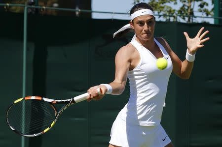 Caroline Garcia of France plays a shot during his match against Heather Watson of Britain at the Wimbledon Tennis Championships in London, June 30, 2015. REUTERS/Suzanne Plunkett