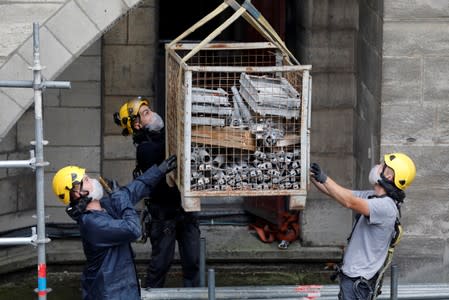 Workers are seen during preliminary work at the Notre-Dame Cathedral in Paris