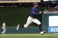 CORRECTS TO THIRD INNING - Minnesota Twins' Byron Buxton races home to score on a sacrifice fly by Mitch Garver in the third inning of a baseball game against the Detroit Tigers, Tuesday, Sept. 28, 2021, in Minneapolis. (AP Photo/Jim Mone)