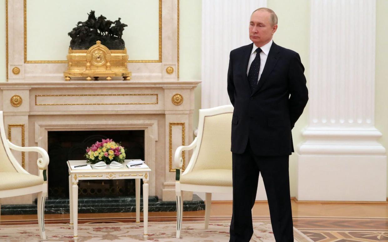 Russian President Vladimir Putin is shown in Moscow in March 2022, shortly after Russia invaded Ukraine. <a href="https://media.gettyimages.com/id/1239099202/photo/topshot-russia-belarus-diplomacy.jpg?s=1024x1024&w=gi&k=20&c=3n424YJ42P5f8iJ9ypEUwoPh9b0mtpT2aAr4o6ItF7o=" rel="nofollow noopener" target="_blank" data-ylk="slk:Mikhaul Klimentyev/Sputnik/AFP via Getty Images;elm:context_link;itc:0;sec:content-canvas" class="link ">Mikhaul Klimentyev/Sputnik/AFP via Getty Images</a>