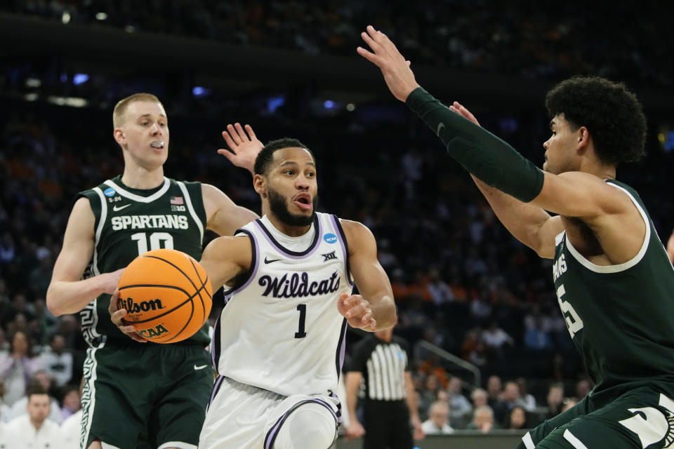 Kansas State guard Markquis Nowell (1) passes around the defense of Michigan State forward Malik Hall in the second half of a Sweet 16 college basketball game in the East Regional of the NCAA tournament at Madison Square Garden, Thursday, March 23, 2023, in New York. (AP Photo/Frank Franklin II)
