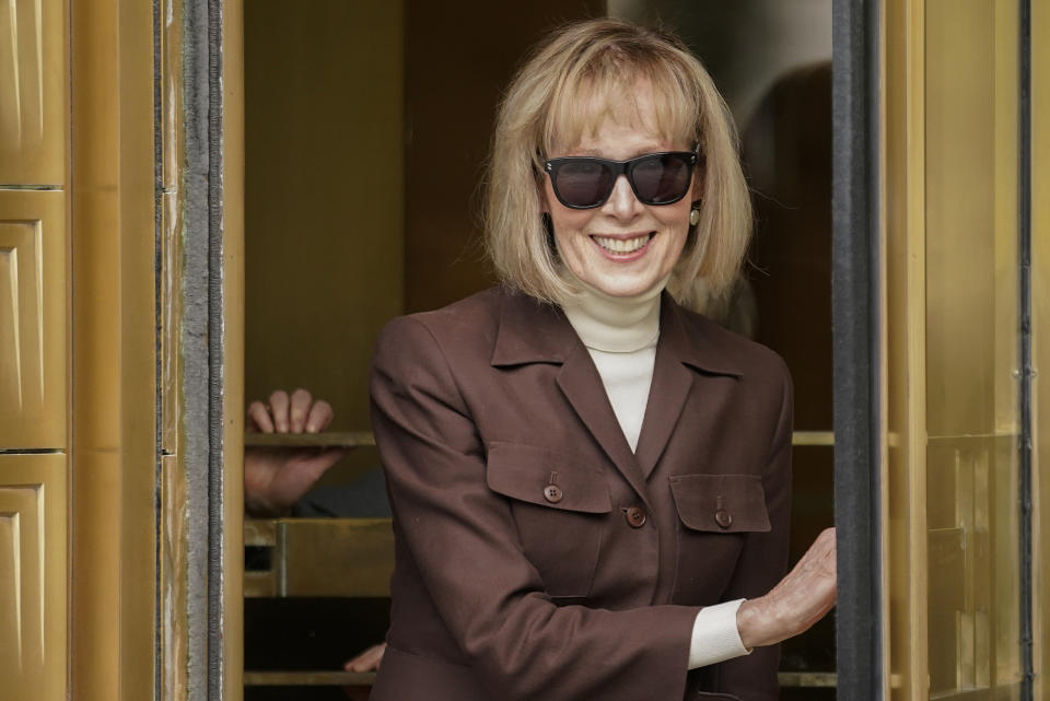 FILE - E. Jean Carroll, center, walks out of federal court in Manhattan, May 9, 2023, in New York. A federal judge upheld a $5 million jury verdict against Donald Trump on Wednesday, rejecting the former president’s claim that the award was excessive and that a jury in a civil case vindicated him by failing to conclude that he raped a columnist in a luxury department store dressing room in the 1990s. (AP Photo/John Minchillo, File)