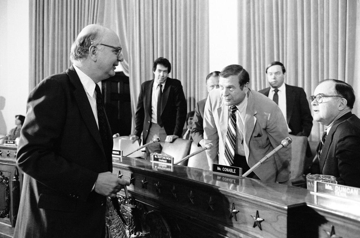 Chairman of the Federal Reserve Board Paul Volcker, left, says a word to the Chairman of the House Ways and Means Committee Dan Rostenkowski of Illinois and Rep. Barber Conable (R-N.Y.), Feb. 23, 1982 on Capitol Hill in Washington, prior to appearing before the panel concerning the economic condition of the U.S.