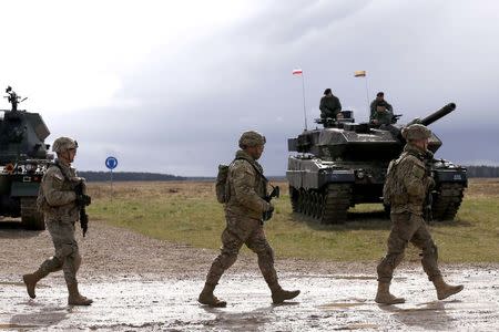 REFILE- CORRECTING DATE U.S. soldiers arrive to the welcoming ceremony at polygon near Orzysz, Poland, April 13, 2017. REUTERS/Kacper Pempel