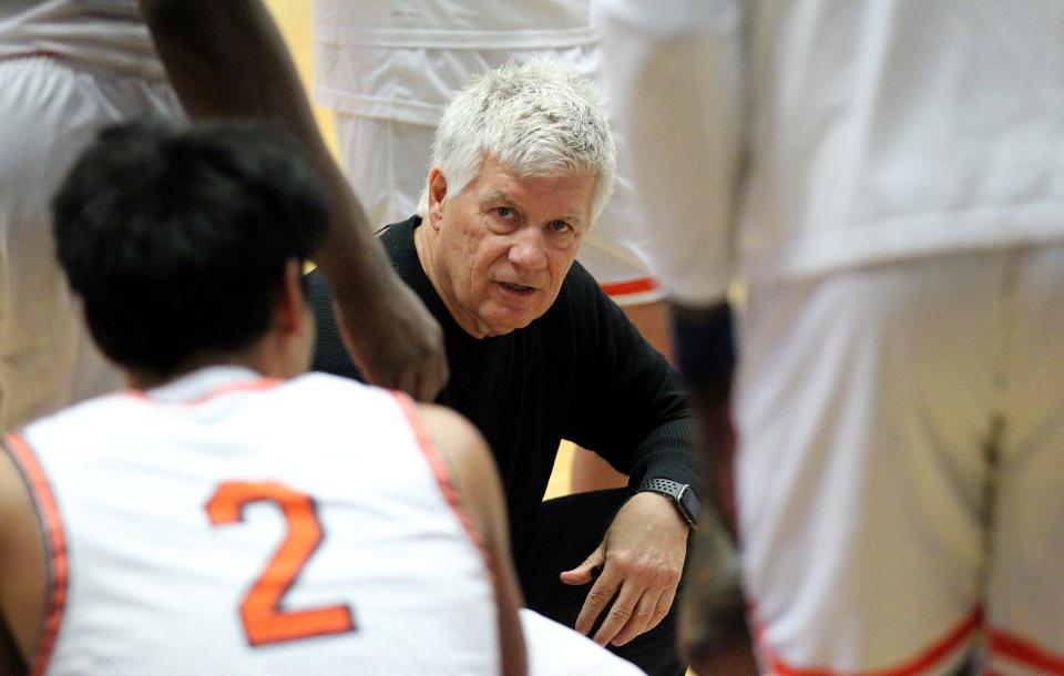 South Plains' Steve Green coaches his players during a time out of their game against South Georgia at the NJCAA Div. I Men's Basketball Championship Tournament Wednesday in the Sports Arena in Hutchinson. South Plains defeated South Georgia 91-90. 