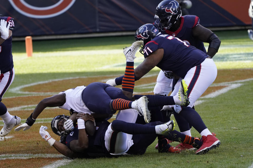 Houston Texans quarterback Deshaun Watson (4) is sacked for a safety by Chicago Bears' Khalil Mack (52) during the first half of an NFL football game, Sunday, Dec. 13, 2020, in Chicago. (AP Photo/Charles Rex Arbogast)