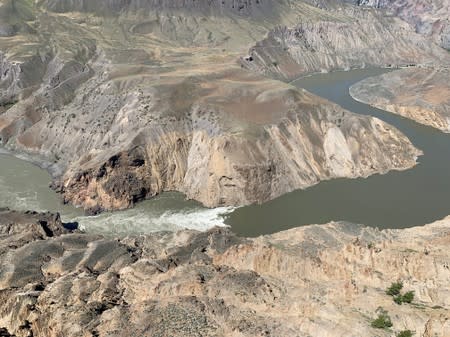 Water flows downstream past the site of the Big Bar landslide on the Fraser River northwest of Clinton