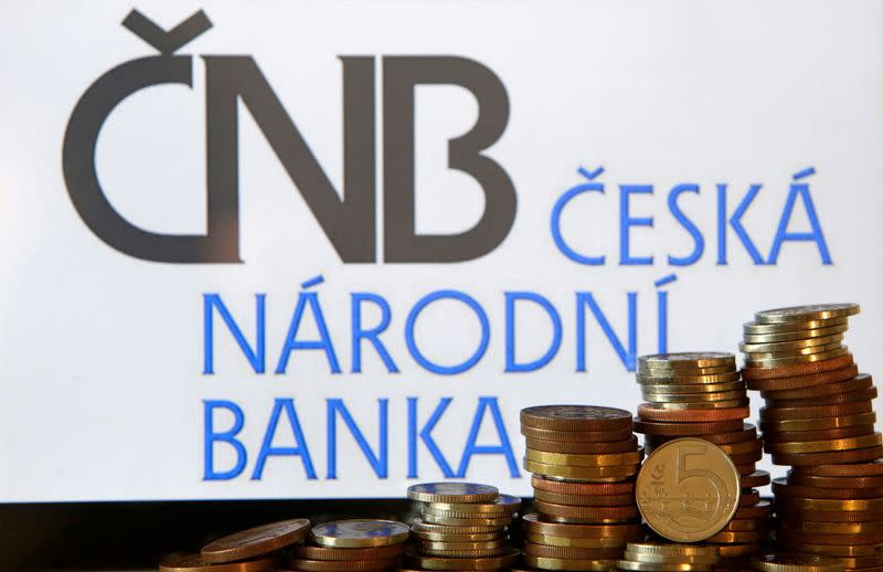 FILE PHOTO: Czech Crown coins are seen in front of a displayed logo of Czech central bank (CNB) in this picture illustration