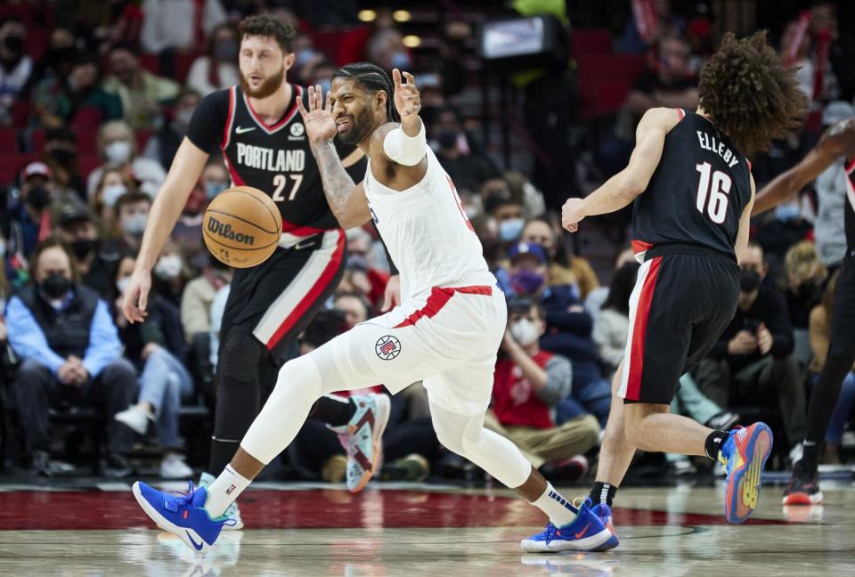 Clippers guard Paul George reacts after being fouled by Portland Trail Blazers guard CJ Elleby.