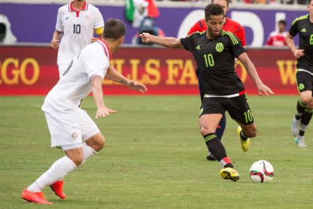 Jun 27, 2015; Orlando, FL, USA; Mexico forward Giovani Dos Santos (10) shoots the ball on the Costa Rica goal during the match at the Orlando Citrus Bowl. Santos scored a goal in the second half. Jerome Miron-USA TODAY Sports