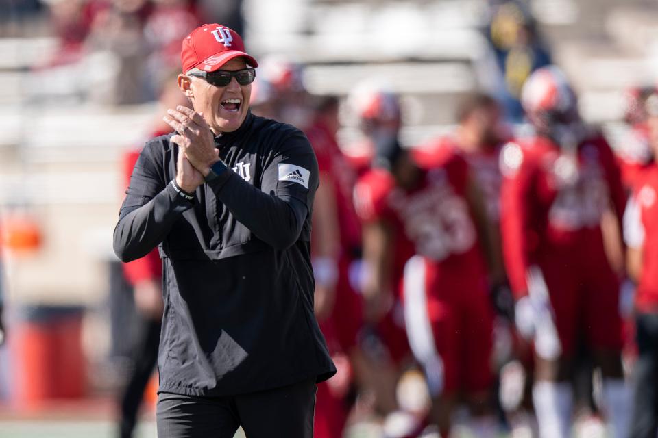 Indiana Hoosiers head coach Tom Allen yells and claps at his team during warmups before the home game Oct. 8, 2022 against the Michigan Wolverines at Memorial Stadium.