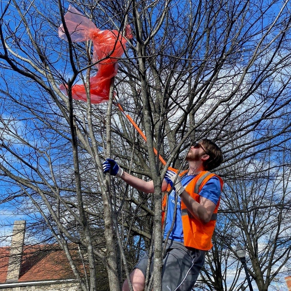 Volunteers remove trash and debris from outdoor spaces during a Keep Knoxville Beautiful event.