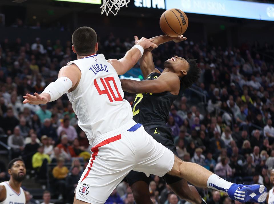 Utah Jazz guard Collin Sexton (2) is fouled by LA Clippers center <a class="link " href="https://sports.yahoo.com/nba/players/5663" data-i13n="sec:content-canvas;subsec:anchor_text;elm:context_link" data-ylk="slk:Ivica Zubac;sec:content-canvas;subsec:anchor_text;elm:context_link;itc:0">Ivica Zubac</a> (40) in Salt Lake City on Friday, Oct. 27, 2023. The Jazz won 120-118. | Jeffrey D. Allred, Deseret News