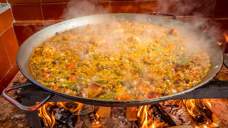 wood fire pan of paella