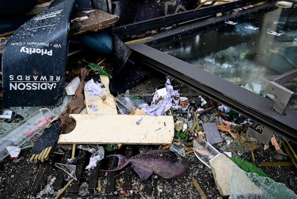 PHOTO: A dead fish lies in the debris in front of the Radisson Blu hotel, where an aquarium located in the hotel's lobby burst, Dec. 16, 2022 in Berlin. (John Macdougall/AFP via Getty Images)