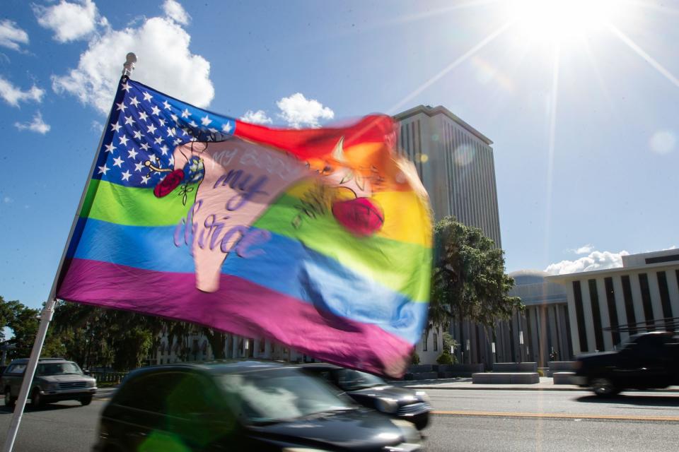 A flag that reads “my body, my choice,” flutters in the wind across the street from Florida Capitol where the House voted ban abortions after six weeks on Thursday, April 13, 2023. 