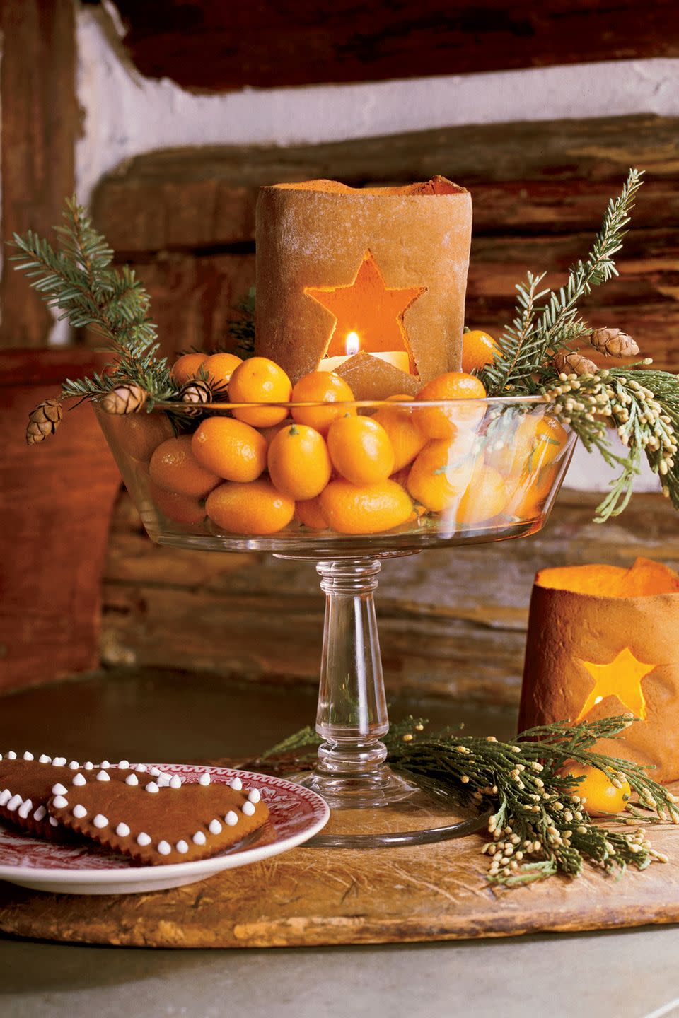 <p>Fill a glass compote dish with fresh clementines, pine boughs, and candles for a display that smells as good as it looks.</p><p><a class="link " href="https://www.amazon.com/Godinger-Italian-Crystal-Dessert-Display/dp/B09CV6R6MV/ref=sr_1_17?tag=syn-yahoo-20&ascsubtag=%5Bartid%7C10050.g.644%5Bsrc%7Cyahoo-us" rel="nofollow noopener" target="_blank" data-ylk="slk:Shop Now;elm:context_link;itc:0;sec:content-canvas">Shop Now</a></p>