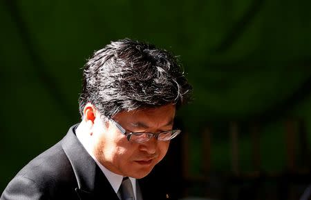 Koichi Hagiuda, an aide to Abe and a lawmaker in the ruling Liberal Democratic Party, visits the Yasukuni Shrine in Tokyo August 15, 2014, to mark the 69th anniversary of Japan's defeat in World War Two. REUTERS/Toru Hanai